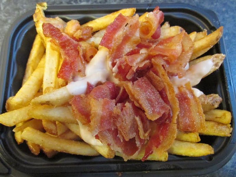 Illustration for article titled Fast-Food Smackdown: McDonald's Mozzarella Sticks Vs. Wendy's Bacon Fondue Fries